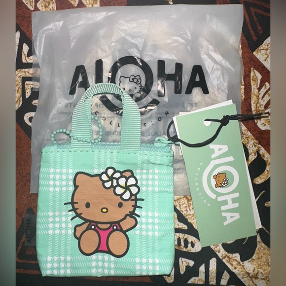 ALOHA Collection Handbags - Hello Kitty x Aloha Collection Green Palaka Tiny Tripper Bag